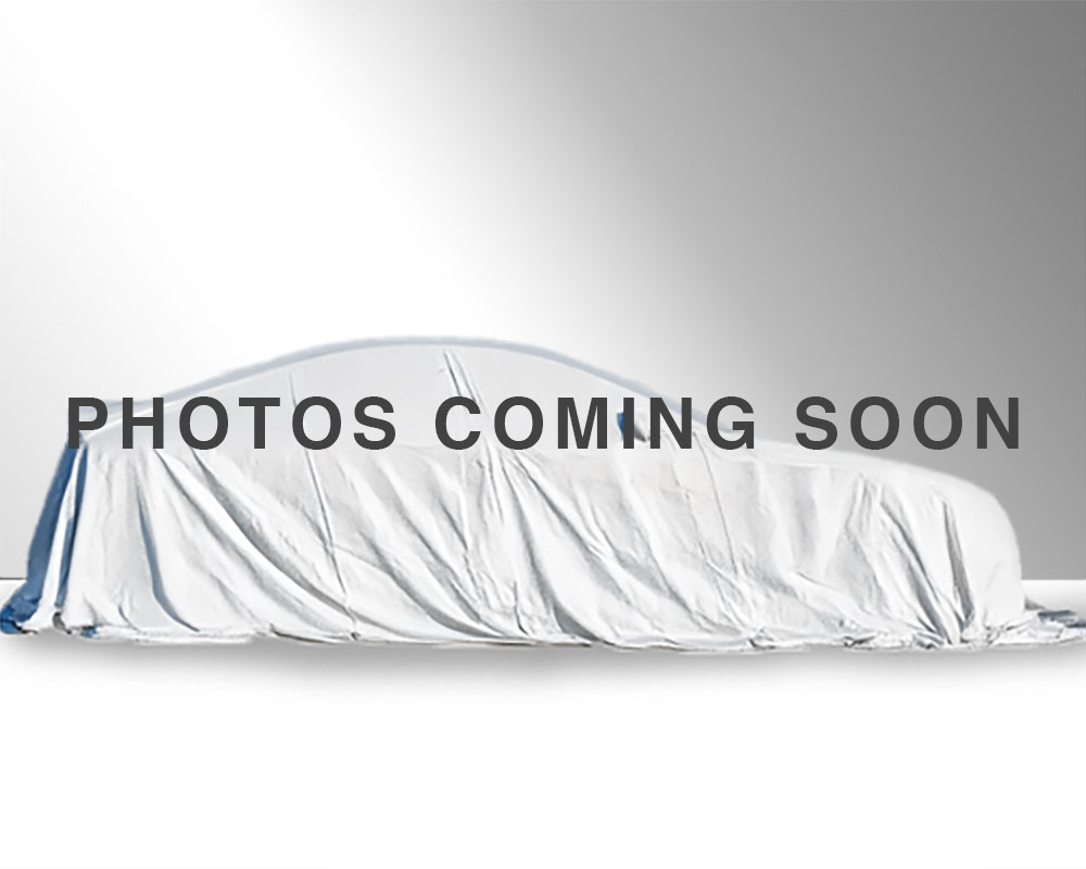 vehicle with a white sheet over it. Text reads coming soon.